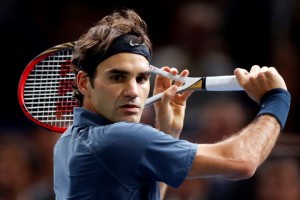 Federer of Switzerland prepares to return to Anderson of South Africa at the Paris Masters men's singles tennis tournament at the Palais Omnisports of Bercy in Paris